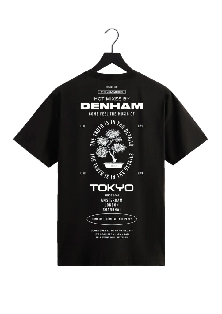 A black t-shirt featuring typography and an image of a bonsai tree in the middle.